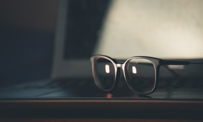 black-glasses-frames-sit-up-on-surface